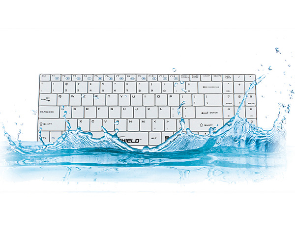 White keyboard immersed in water